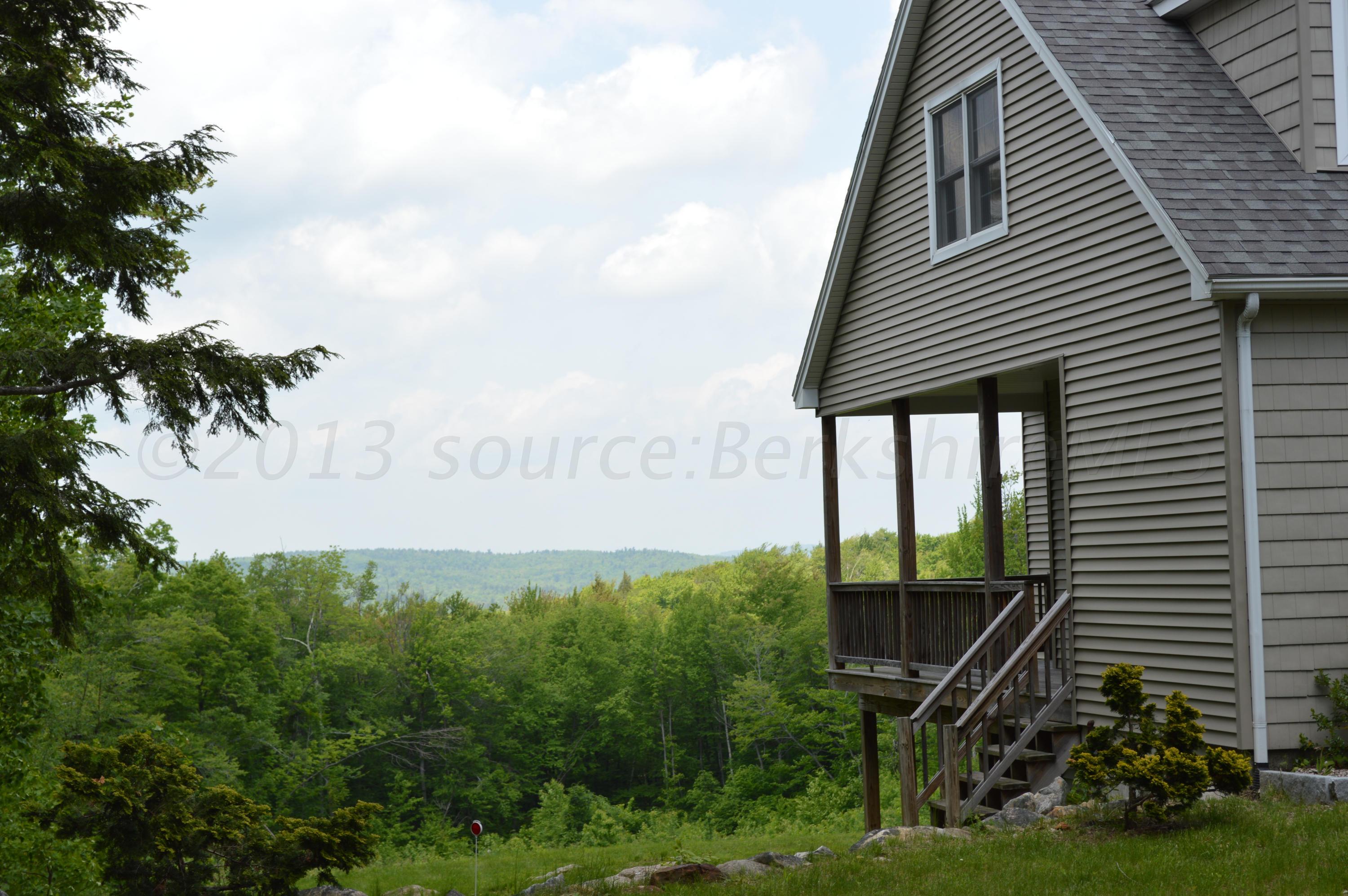269 Skyline Ridge Road Becket, MA 01223 - Photo 2 of 42 a view of a house with a yard