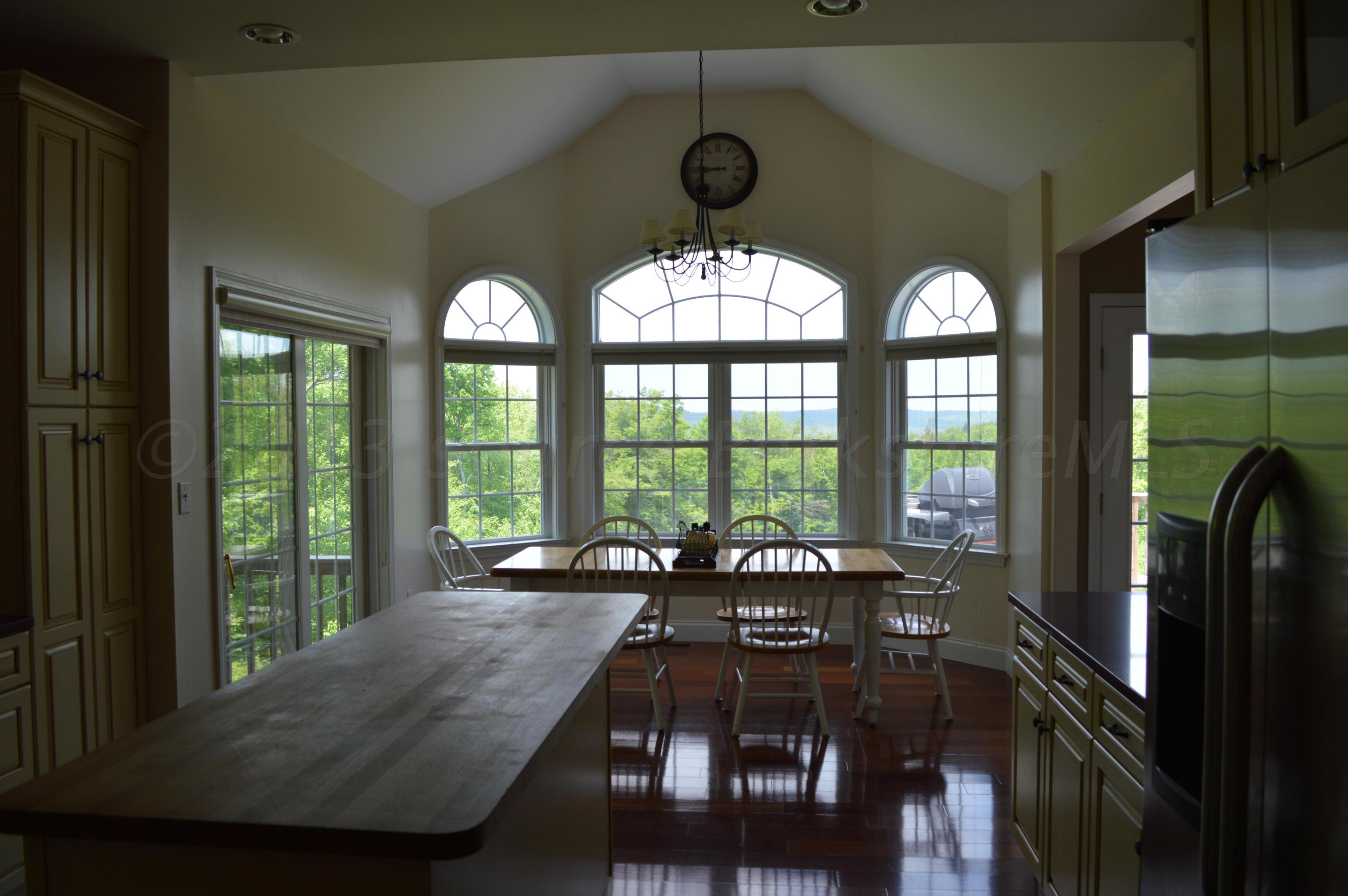 269 Skyline Ridge Road Becket, MA 01223 - Photo 12 of 42 a living room with furniture and a large window