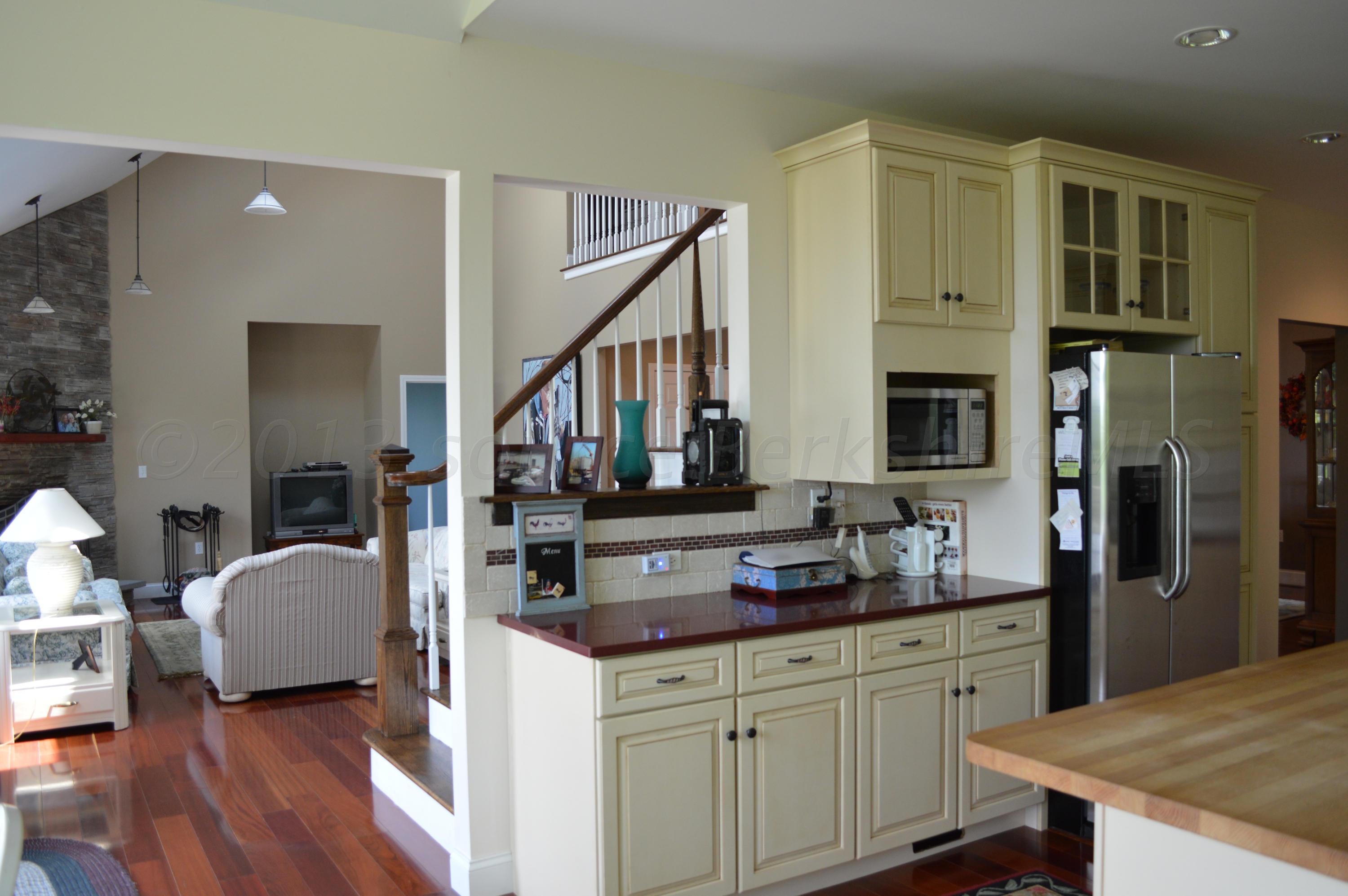 269 Skyline Ridge Road Becket, MA 01223 - Photo 14 of 42 a kitchen with stainless steel appliances granite countertop a refrigerator and a stove top oven