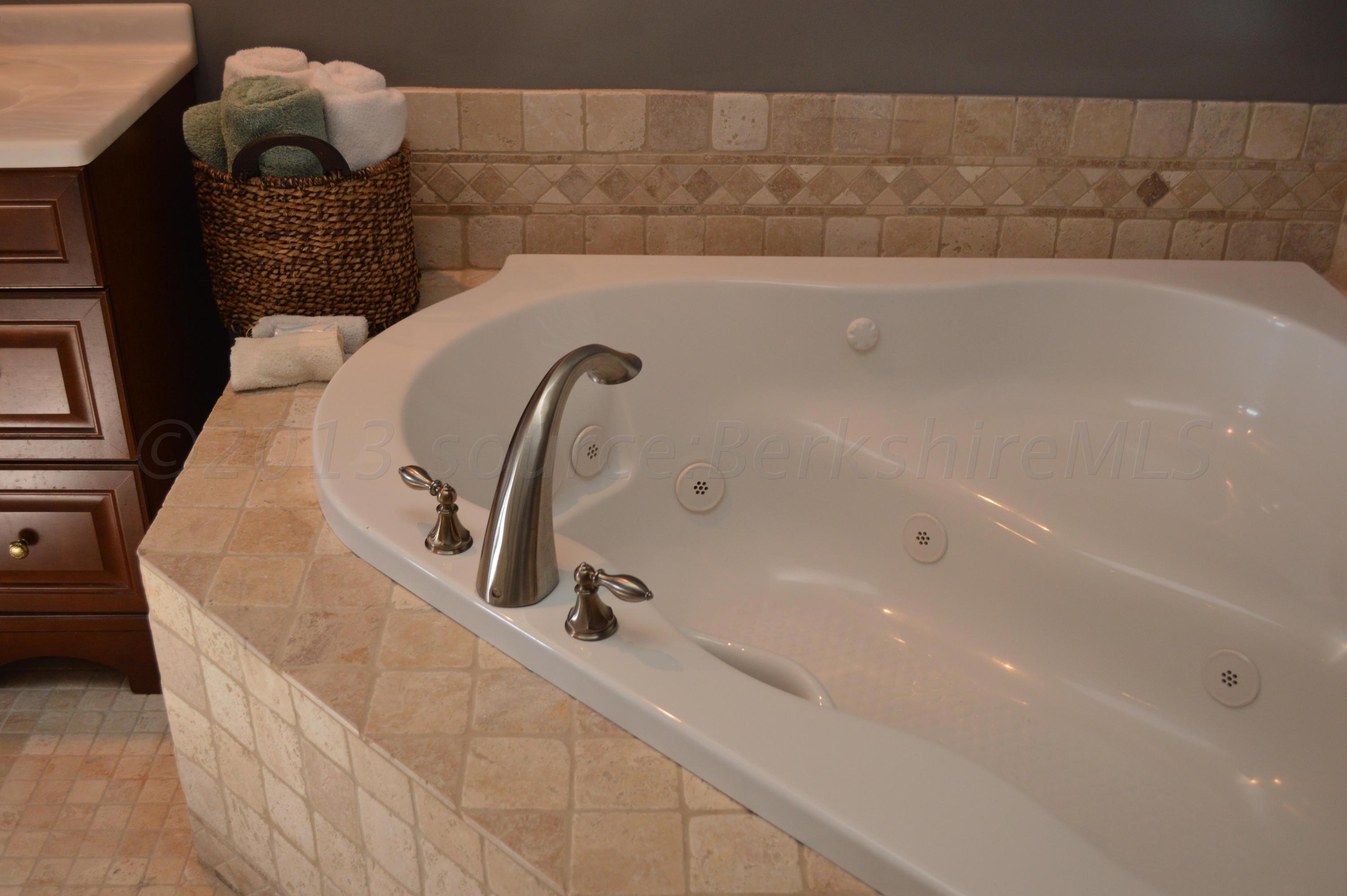 269 Skyline Ridge Road Becket, MA 01223 - Photo 19 of 42 a bathroom with a bathtub
