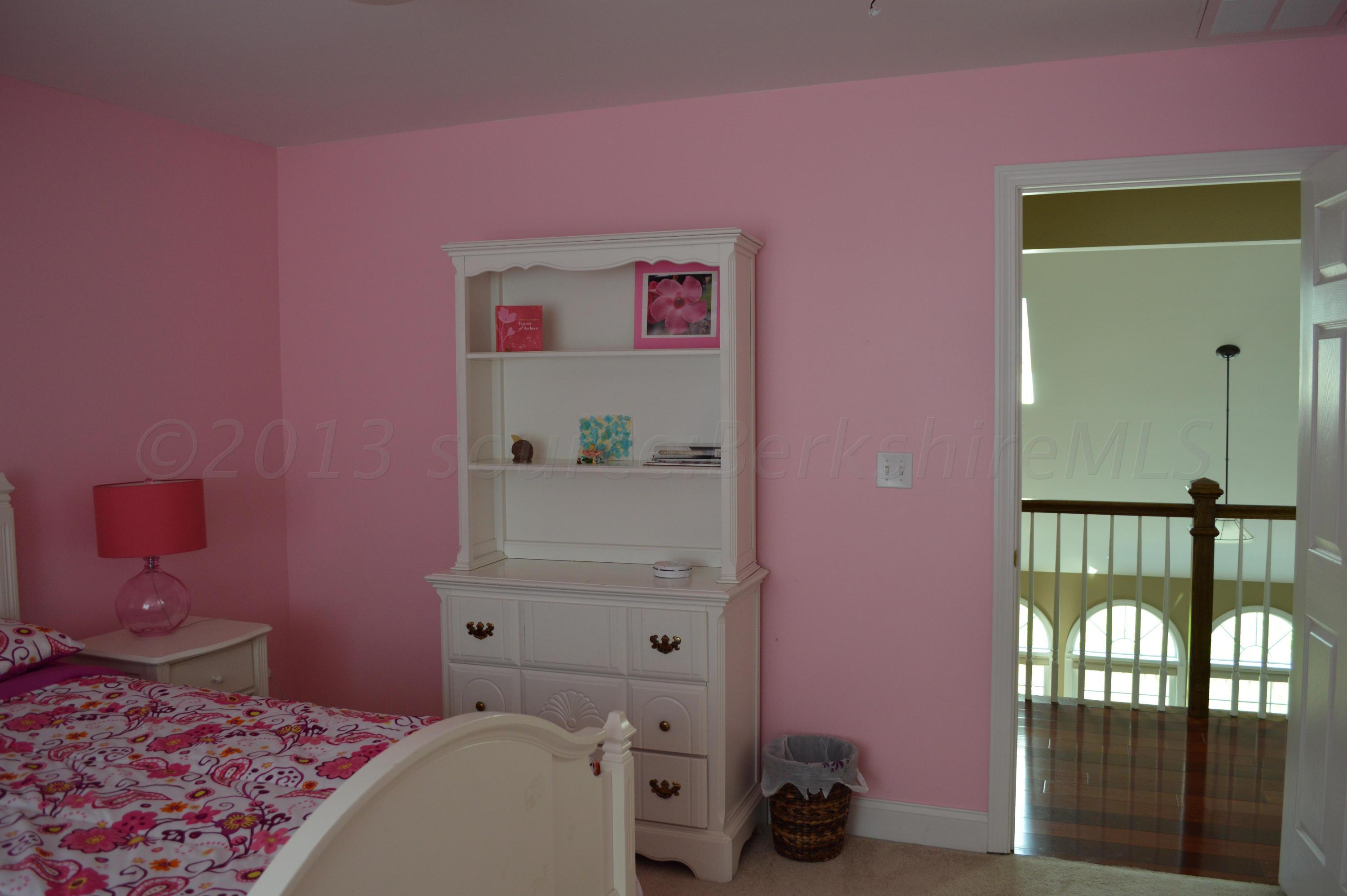 269 Skyline Ridge Road Becket, MA 01223 - Photo 26 of 42 a bedroom with a bed and a window