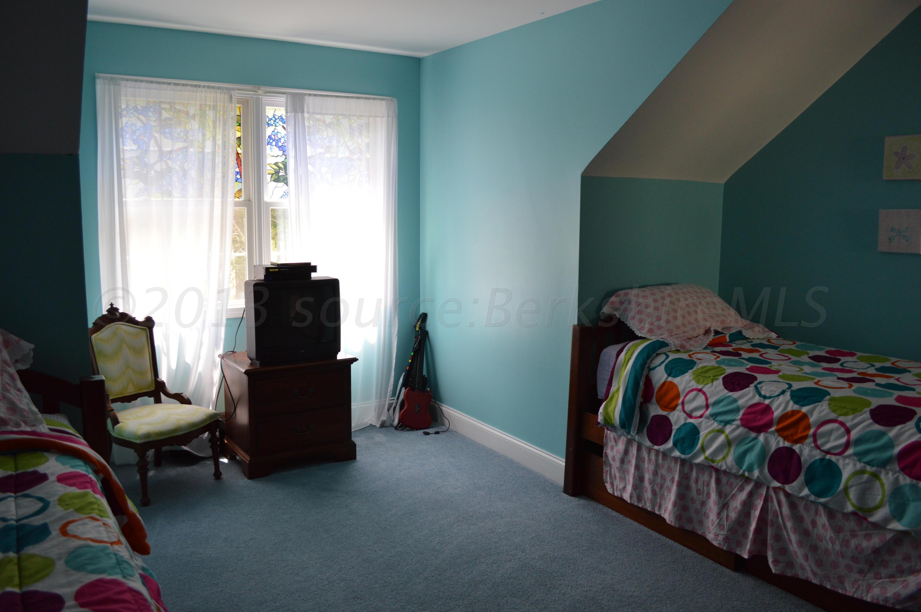 269 Skyline Ridge Road Becket, MA 01223 - Photo 28 of 42 a bedroom with a bed and a window