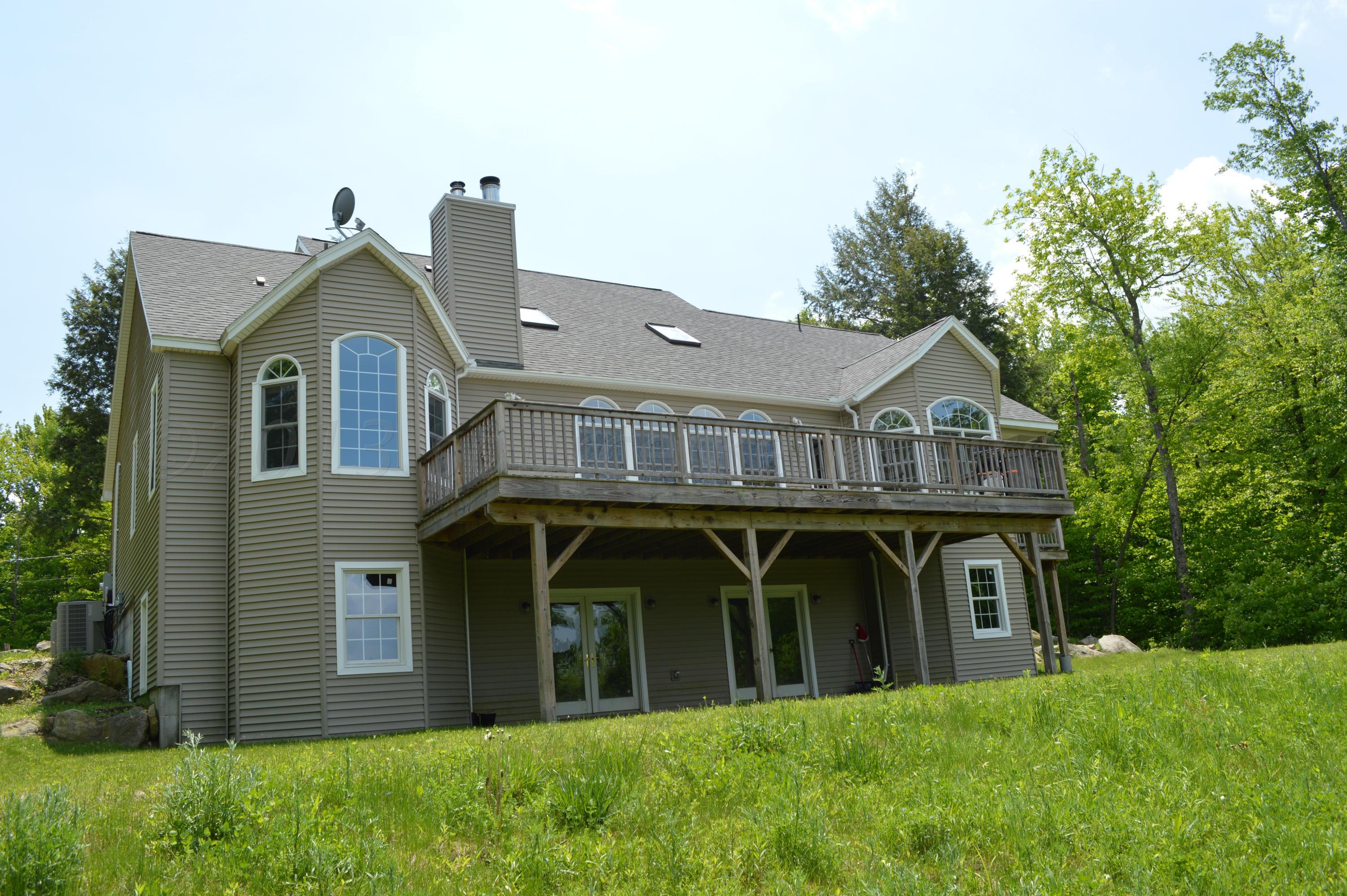269 Skyline Ridge Road Becket, MA 01223 - Photo 31 of 42 a view of a front of house with a yard