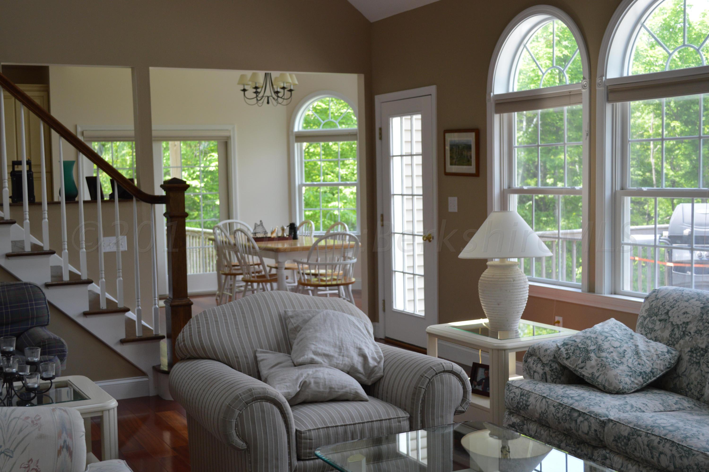 269 Skyline Ridge Road Becket, MA 01223 - Photo 10 of 42 a living room with furniture and a large window