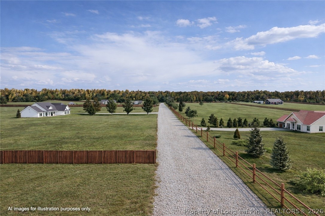 0 Paddock Meadows Red Springs, NC 28377 - Photo 25 of 29 a view of a lake with houses in the back