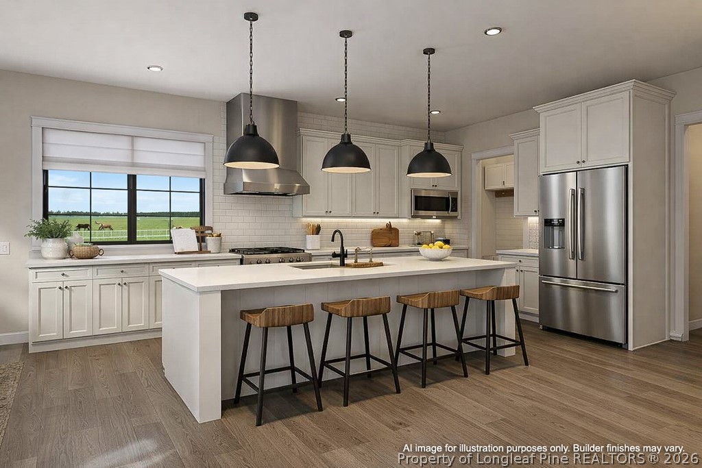 0 Paddock Meadows Red Springs, NC 28377 - Photo 9 of 29 a kitchen with stainless steel appliances granite countertop a sink a stove a refrigerator and island with wooden floor