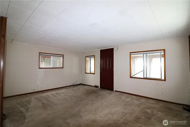 an empty room with windows