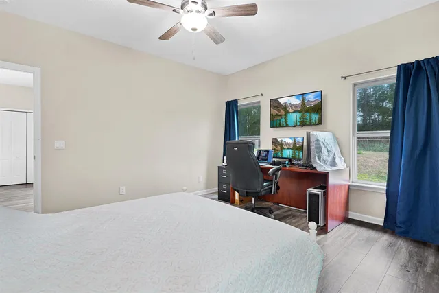 a work room with furniture and a window