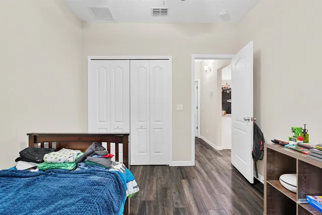 a bed room with a bed and furniture