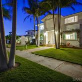 a view of a house with a yard and plants