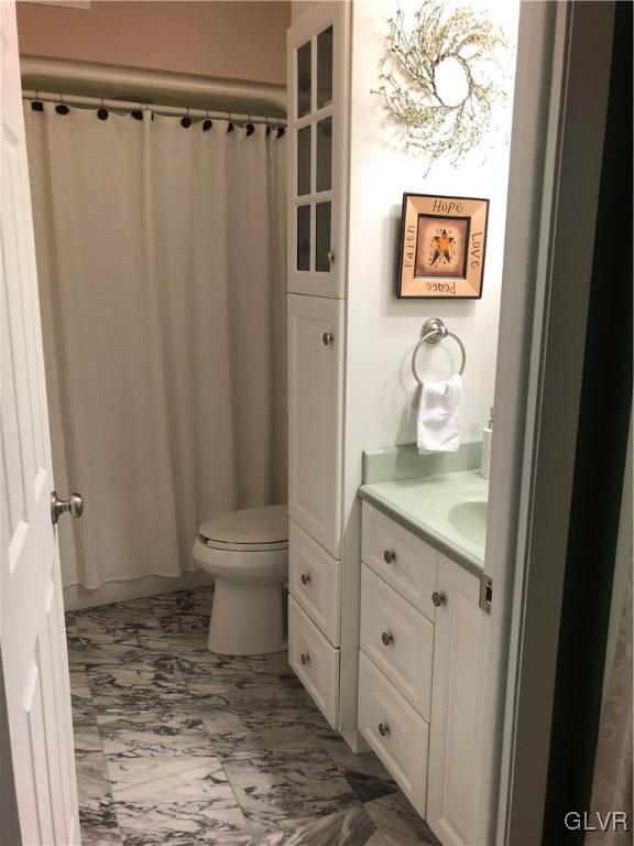 2535 Brunner Road Emmaus, PA 18049 - Photo 11 of 33 a bathroom with a granite countertop sink toilet and shower