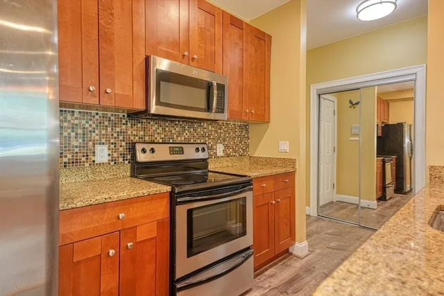 a kitchen with a stove and a microwave