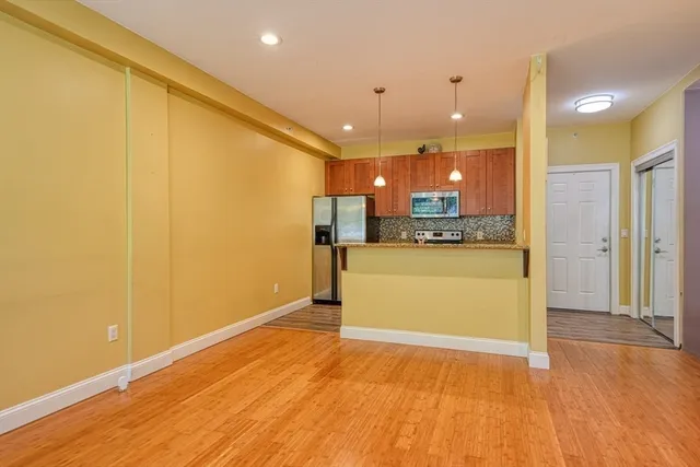 a view of kitchen with wooden floor