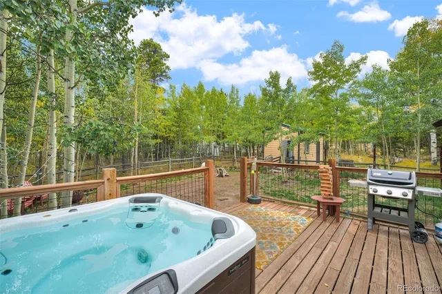 a view of balcony with deck and outdoor seating