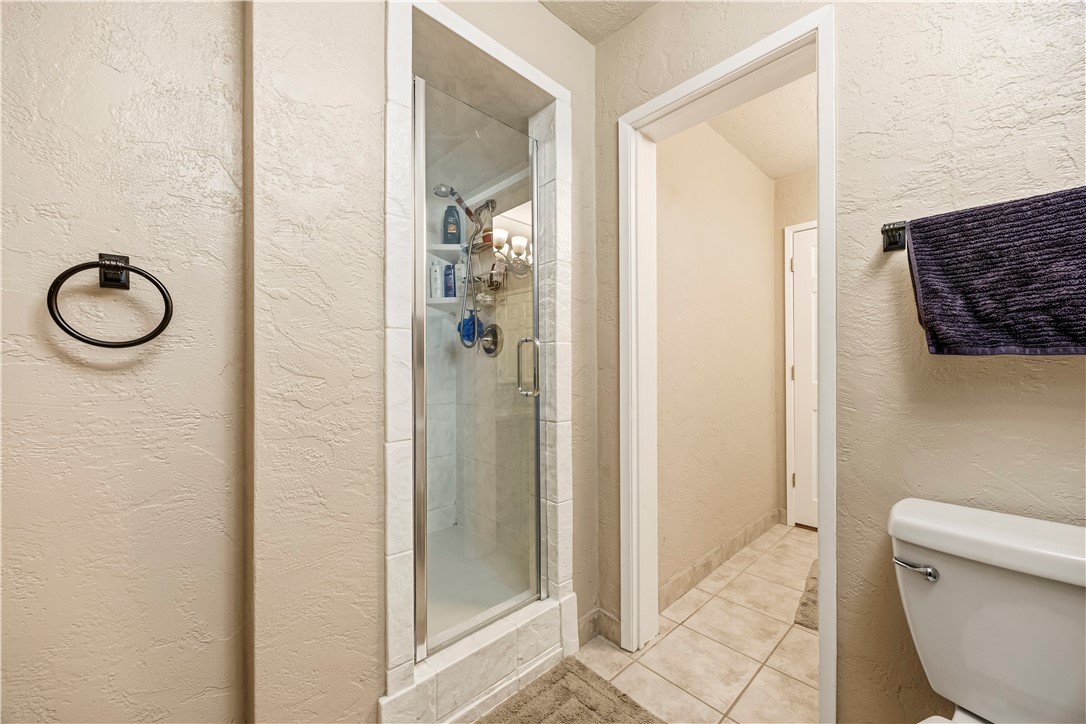 1485 Vía Ladera Fallbrook, CA 92028 - Photo 32 of 43 a bathroom with a granite countertop shower