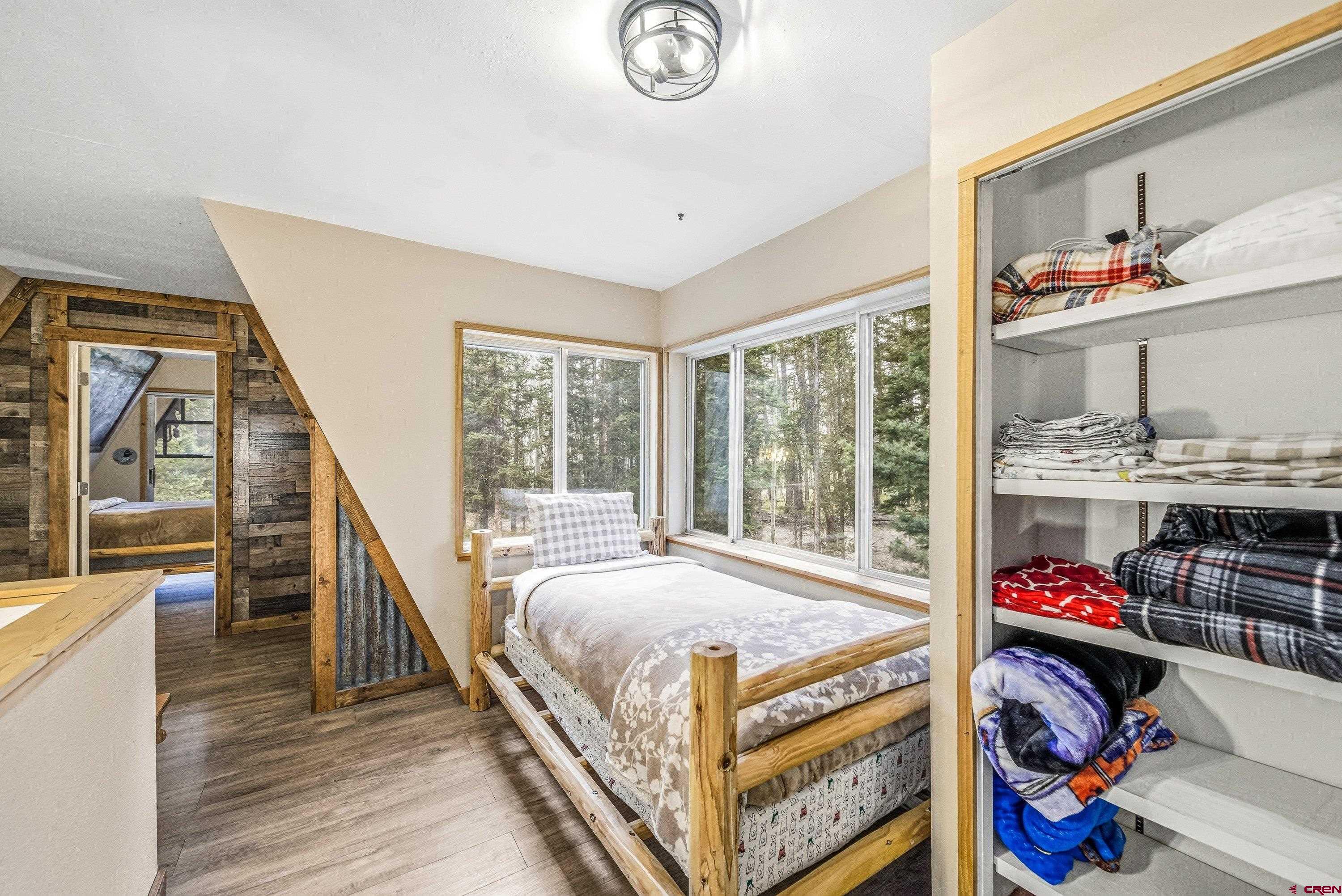 125 Aspen Trail Cimarron, CO 81220 - Photo 16 of 37 a bed room with a bed and a window