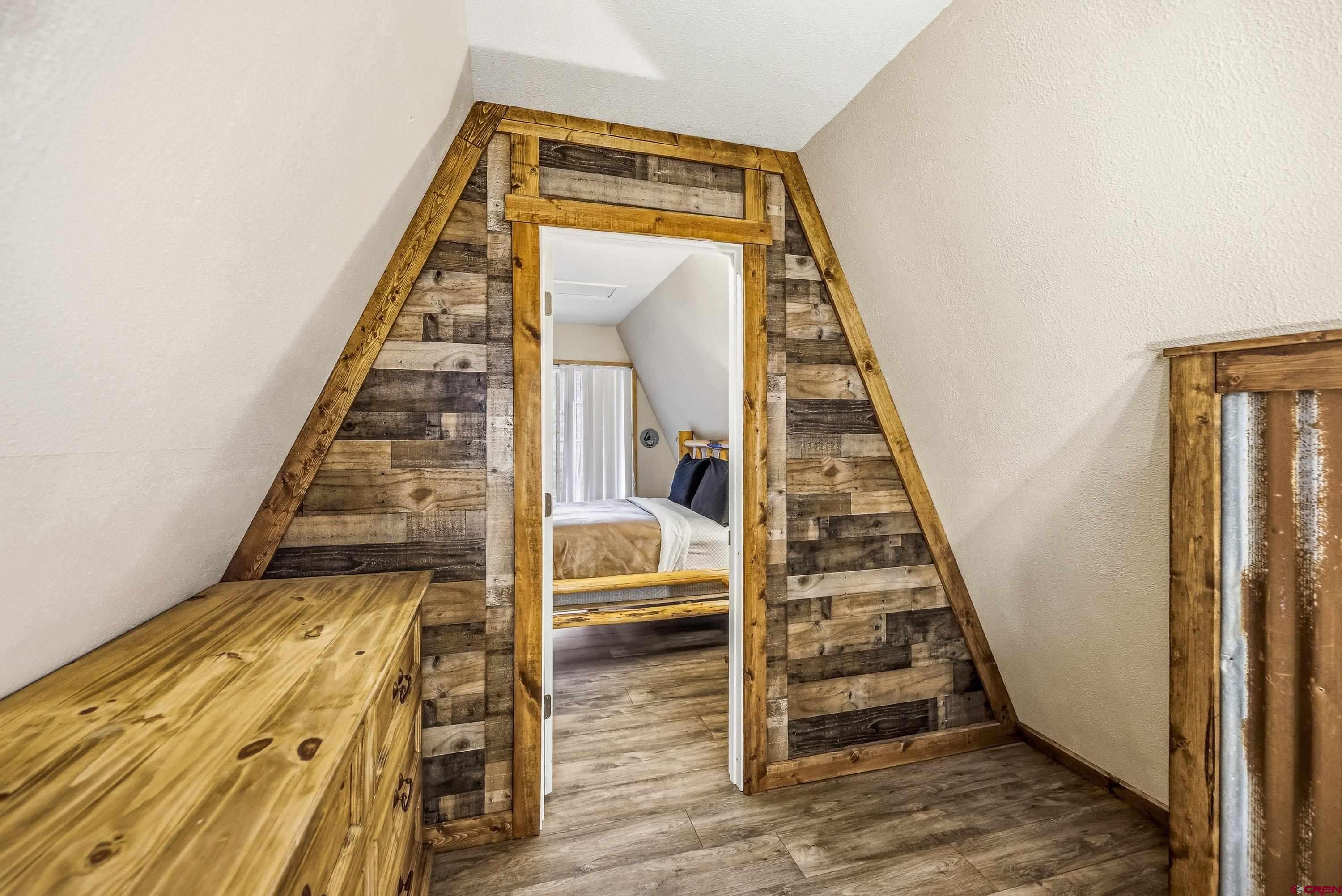 125 Aspen Trail Cimarron, CO 81220 - Photo 21 of 37 a view of staircase with wooden floor and white walls
