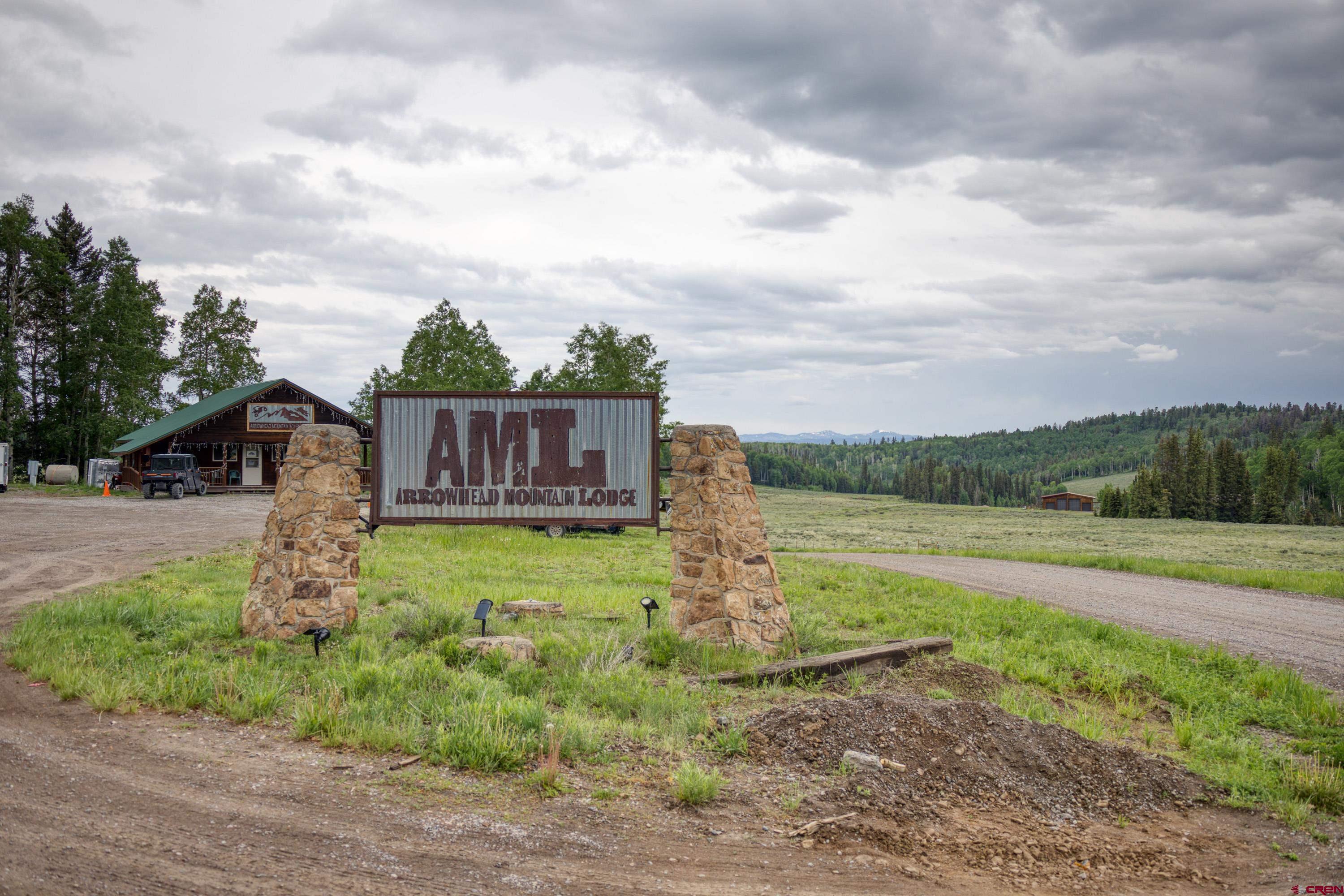 125 Aspen Trail Cimarron, CO 81220 - Photo 30 of 37 a front view of a house with garden