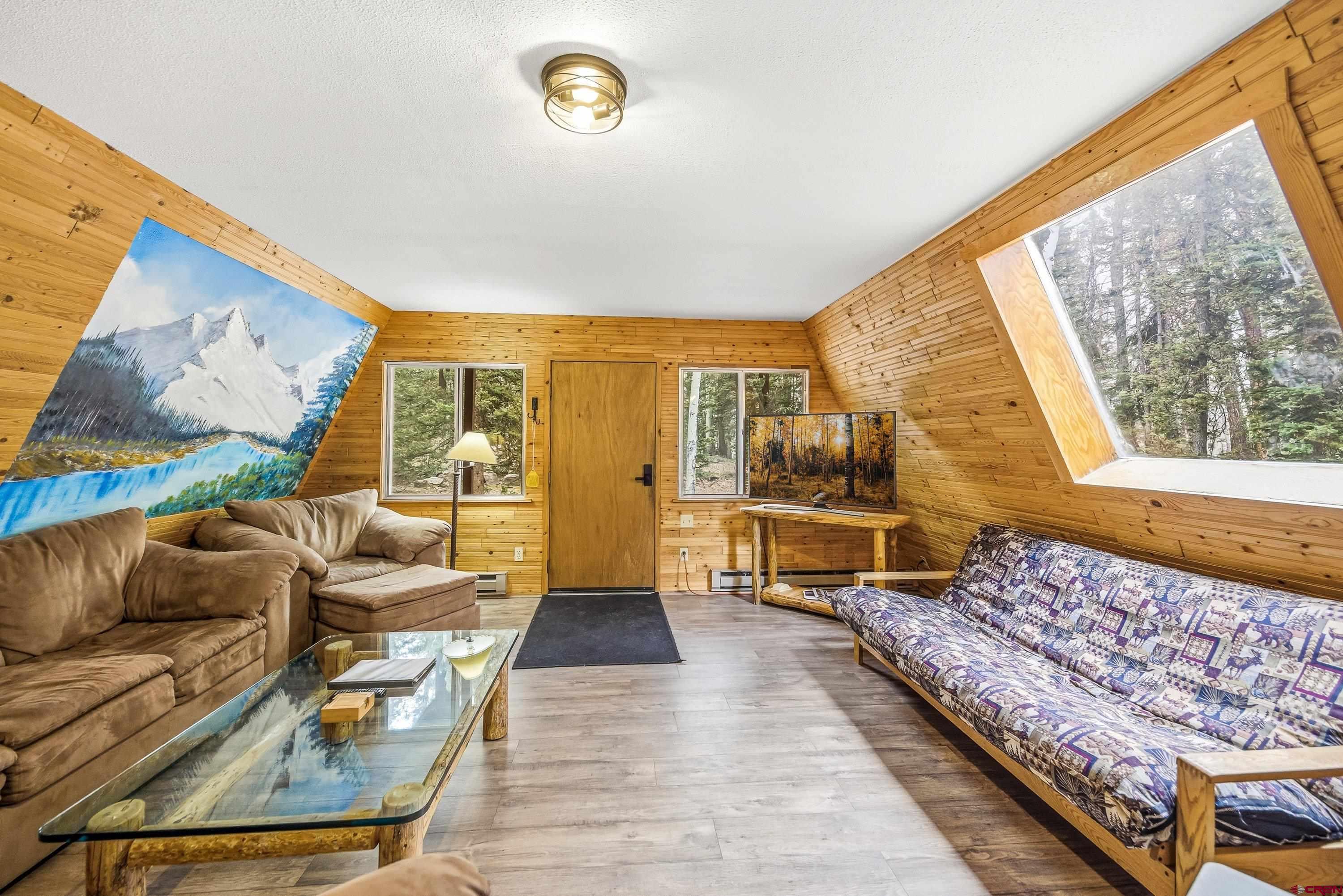 125 Aspen Trail Cimarron, CO 81220 - Photo 4 of 37 a living room with furniture and a large window