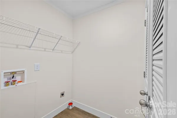 a view of storage and utility room with empty racks