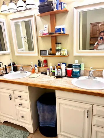 a bathroom with a sink and a mirror