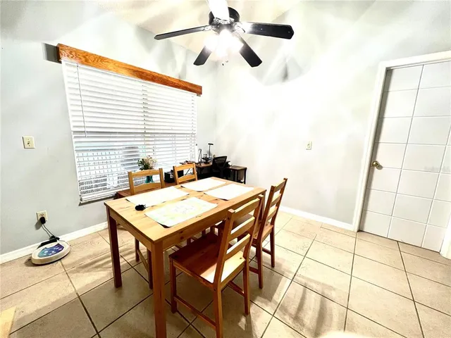 a view of a dining hall with a table and chairs