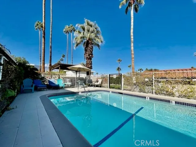 a view of a swimming pool with a patio