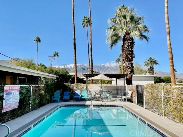 a view of a chairs and table in the patio
