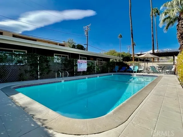 a view of a swimming pool with a patio