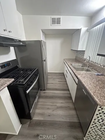 a kitchen with a stove and a microwave