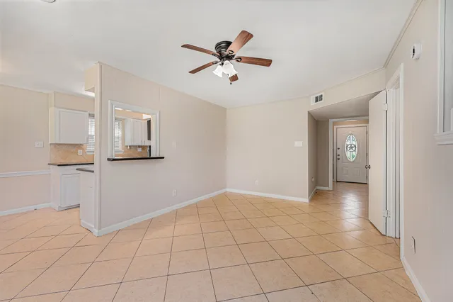 a view of an empty room and window