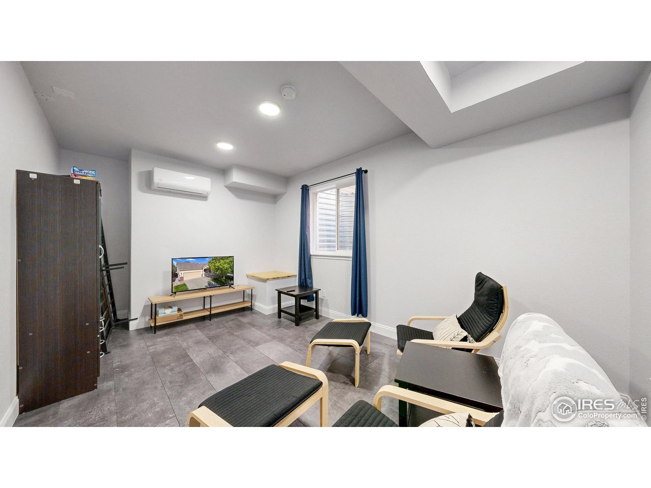 10527 Troy Street Commerce City, CO 80022 - Photo 26 of 35 Downstairs bedroom #6 as a TV Room or make into a rec room.