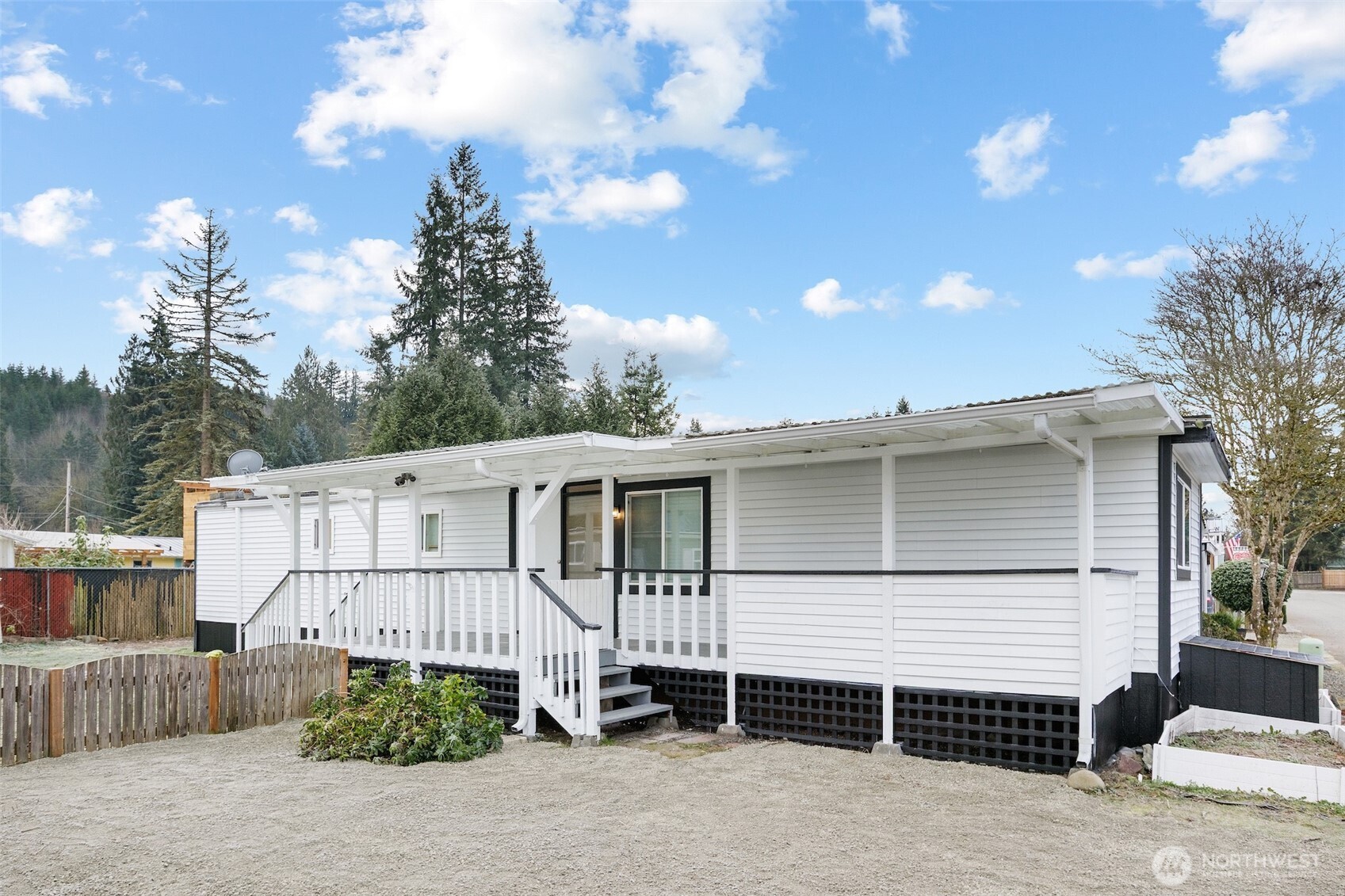 32501 Northeast 50th Street, Unit 37 Carnation, WA 98014 - Photo 19 of 20 a white house with tree in the background