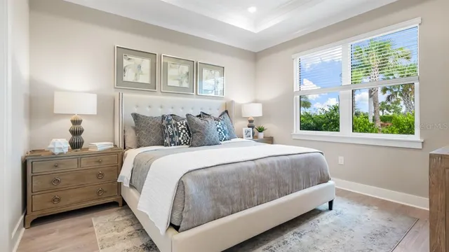 a bedroom with a bed and a dresser