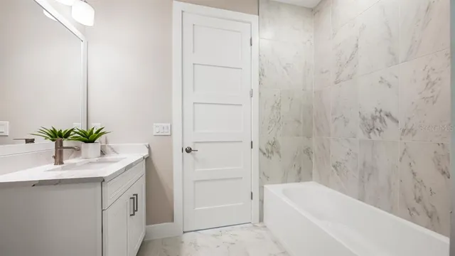 a view of a house with a small yard and plants