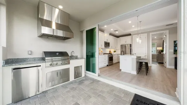 a view of a swimming pool with a table and chairs