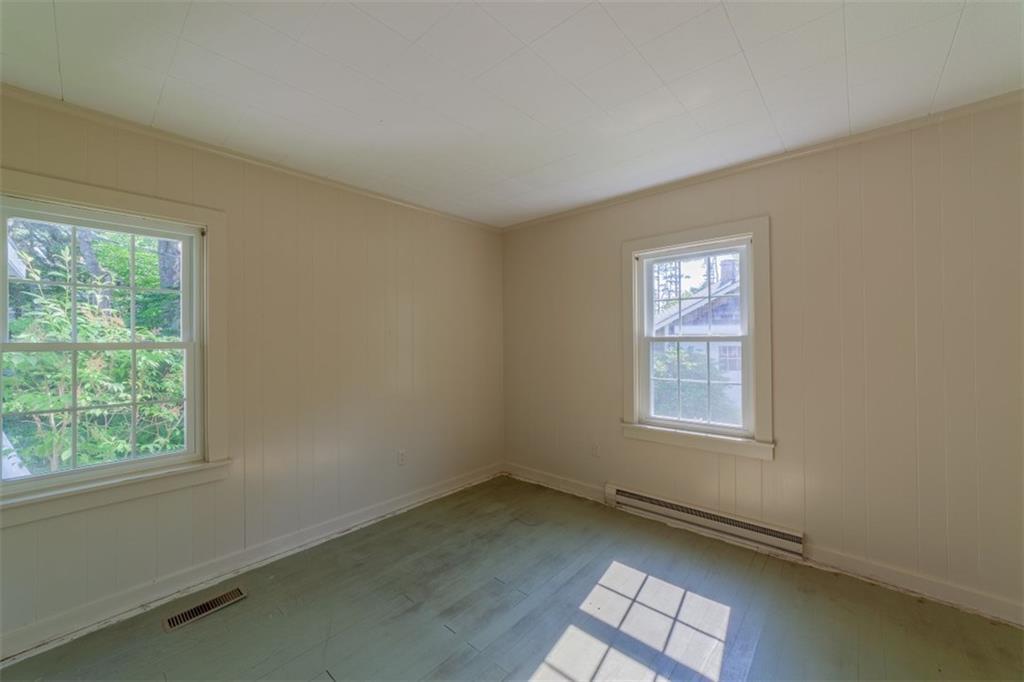 8 Pond Head Road Southport, ME 04576 - Photo 18 of 20 Third bedroom with wood paneling,...