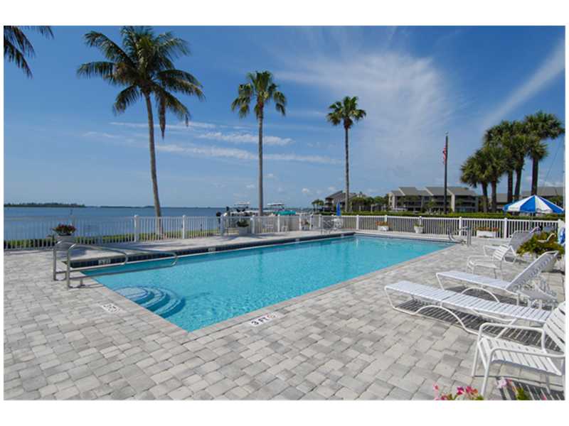 1901 Bay Road, Unit 203 Vero Beach, FL 32963 - Photo 1 of 22 a view of a swimming pool and a chair