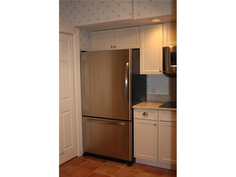 1901 Bay Road, Unit 203 Vero Beach, FL 32963 - Photo 11 of 22 a refrigerator freezer sitting in a kitchen