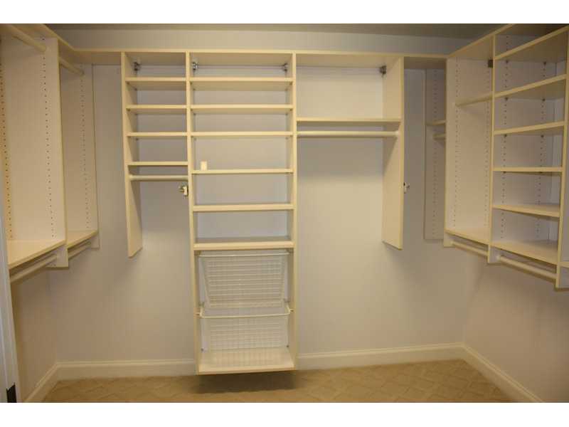 1901 Bay Road, Unit 203 Vero Beach, FL 32963 - Photo 18 of 22 a view of walk in closet with empty racks