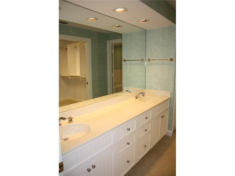 1901 Bay Road, Unit 203 Vero Beach, FL 32963 - Photo 19 of 22 a bathroom with a sink and a mirror