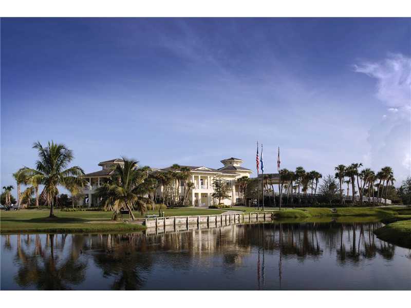 1901 Bay Road, Unit 203 Vero Beach, FL 32963 - Photo 4 of 22 a view of swimming pool and trees in the background
