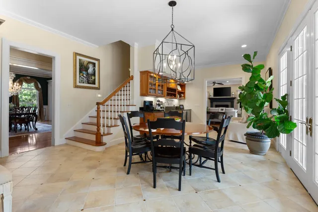 a living room with furniture ceiling fan and a rug
