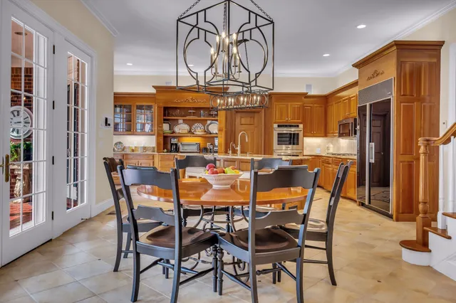 a living room with furniture fireplace and a large window