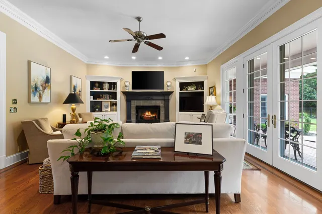 a view of a livingroom with furniture and a flat screen tv
