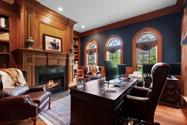 a living room with furniture and a air conditioner vent