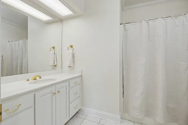 an empty room with a ceiling fan and window