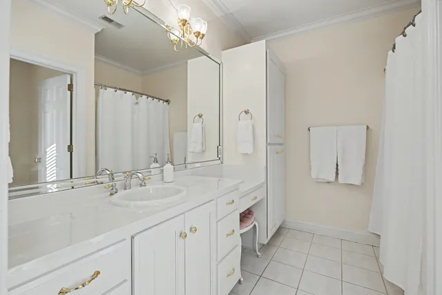 a living room with furniture pool table and window