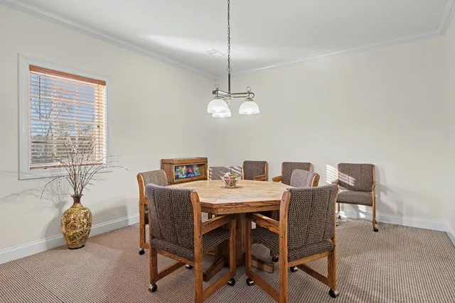 a spacious bathroom with a granite countertop sink and a mirror