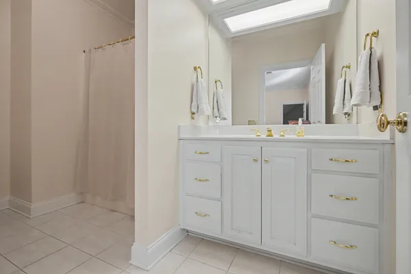 a view of a house with swimming pool and sitting area